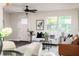 Bright and inviting living room with white sofa, stylish decor, and natural light at 1008 E Norfolk St, Tampa, FL 33604