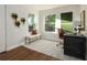 Bright office featuring two windows, modern desk, wooden floors, and contemporary decor at 1008 E Norfolk St, Tampa, FL 33604