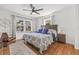 Bright bedroom featuring hardwood floors, coastal decor, and natural light from the large windows at 1010 26Th N Ave, St Petersburg, FL 33704