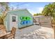 Exterior view featuring kayaks, a white door, a screened-in pool, and paver patio at 1010 26Th N Ave, St Petersburg, FL 33704