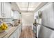 Bright kitchen featuring stainless steel appliances and neutral color palette at 11050 Auburndale St, Spring Hill, FL 34609