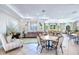 Community room features tables, chairs, and a cozy lounge area at 11218 Coventry Grove Cir, Lithia, FL 33547