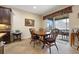 Cozy dining area with wood table, sliding door access to lanai for relaxed entertaining at 11218 Coventry Grove Cir, Lithia, FL 33547