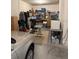 Cluttered garage space shows storage options and room for parking at 11218 Coventry Grove Cir, Lithia, FL 33547