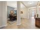 Inviting foyer with tile flooring leading into the dining room at 11218 Coventry Grove Cir, Lithia, FL 33547