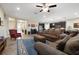 Spacious living room with kitchen and dining area. Neutral walls and tile floors throughout at 11218 Coventry Grove Cir, Lithia, FL 33547