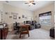 Office featuring carpeted floors, brown recliners, dark wood desk and natural light at 11218 Coventry Grove Cir, Lithia, FL 33547