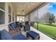 Covered outdoor patio with comfortable seating and ceiling fans at 11218 Coventry Grove Cir, Lithia, FL 33547