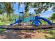 Community playground featuring blue slides and climbing structures for enjoyment at 11218 Coventry Grove Cir, Lithia, FL 33547