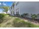 Exterior view of a building with a grassy lawn area at 12041 Hoosier Ct # 104, Hudson, FL 34667
