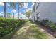 Exterior view of a building with a grassy lawn area at 12041 Hoosier Ct # 104, Hudson, FL 34667