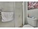 Clean bathroom featuring a shower with glass doors and a modern toilet at 12041 Hoosier Ct # 104, Hudson, FL 34667