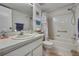 Bright bathroom featuring a shower-tub combo and vanity at 12041 Hoosier Ct # 104, Hudson, FL 34667