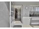 Inviting entryway featuring tile floors, neutral paint, and a glimpse into the home's interior at 12041 Hoosier Ct # 104, Hudson, FL 34667