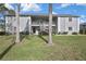 Two-story apartment building with well-maintained lawn at 12041 Hoosier Ct # 104, Hudson, FL 34667