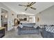 Relaxing living room with an open layout, plush seating, and seamless flow to the kitchen at 12041 Hoosier Ct # 104, Hudson, FL 34667