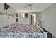 Calm bedroom with white furniture, soft carpet, and ensuite bathroom entrance at 12041 Hoosier Ct # 104, Hudson, FL 34667