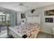 Comfortable bedroom with access to a private balcony and ample closet space at 12041 Hoosier Ct # 104, Hudson, FL 34667