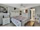 Inviting bedroom with a decorative bed frame, neutral walls, and ensuite bathroom access at 12041 Hoosier Ct # 104, Hudson, FL 34667