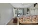 Bedroom with a queen bed and balcony access at 12041 Hoosier Ct # 104, Hudson, FL 34667