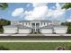 Charming townhome with a symmetrical facade, featuring a manicured lawn and inviting curb appeal at 12785 Jade Empress Loop # 102, Venice, FL 34293