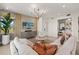Comfortable living room featuring contemporary furnishings and plenty of natural light at 12785 Jade Empress Loop # 102, Venice, FL 34293
