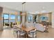 Spacious living room featuring sliding glass doors and waterfront views at 12785 Jade Empress Loop # 102, Venice, FL 34293