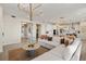 Open-concept living space featuring a comfortable living room adjacent to a modern kitchen at 12785 Jade Empress Loop # 102, Venice, FL 34293