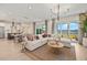 Open-concept living space featuring a comfortable living room adjacent to a modern kitchen at 12785 Jade Empress Loop # 102, Venice, FL 34293