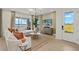 Bright living room with comfortable seating and view of the lake at 12785 Jade Empress Loop # 102, Venice, FL 34293
