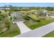 Beautiful aerial shot of a single Gathering house with well manicured landscaping at 135 Cabana Way, Rotonda West, FL 33947