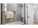 Clean bathroom with a shower-tub combination and neutral-toned tile at 135 Cabana Way, Rotonda West, FL 33947