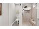 Well-lit bathroom with a tiled walk-in shower and built-in bench seating at 135 Cabana Way, Rotonda West, FL 33947