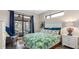 Bright bedroom with patio access and tranquil outdoor views at 135 Cabana Way, Rotonda West, FL 33947