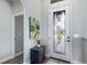 Bright foyer with decorative glass door, stylish interior door, and neutral wall color at 135 Cabana Way, Rotonda West, FL 33947