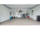 A spacious two car garage with lots of storage and coated concrete floors at 135 Cabana Way, Rotonda West, FL 33947