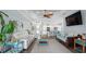 Spacious living room with hardwood floors, open to the kitchen, and plenty of natural light at 135 Cabana Way, Rotonda West, FL 33947