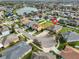 Aerial view of home and neighborhood with community lake at 13908 Artesa Bell Dr, Riverview, FL 33579