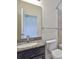 Granite countertop sink with a large mirror, decorative fixtures, and new toilet at 13908 Artesa Bell Dr, Riverview, FL 33579