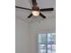 Bright bedroom with ceiling fan and window with plantation shutters at 13908 Artesa Bell Dr, Riverview, FL 33579