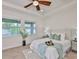 Bright bedroom featuring neutral colors, new furniture, a ceiling fan, and natural light at 13908 Artesa Bell Dr, Riverview, FL 33579