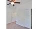 Clean bedroom with plush carpeting and a closet at 13908 Artesa Bell Dr, Riverview, FL 33579