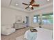 Bright bedroom featuring neutral colors, new furniture, a ceiling fan, and natural light at 13908 Artesa Bell Dr, Riverview, FL 33579