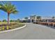 Beautiful clubhouse entrance with lush landscaping and ample parking at 13908 Artesa Bell Dr, Riverview, FL 33579