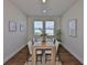 Dining room with a new table setting for six, modern light fixtures, and bright natural light at 13908 Artesa Bell Dr, Riverview, FL 33579
