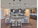 Modern kitchen with granite countertops, stainless steel appliances, and a large island at 13908 Artesa Bell Dr, Riverview, FL 33579