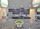 Granite countertops, stainless steel appliances, and dark cabinets add style and function to this kitchen at 13908 Artesa Bell Dr, Riverview, FL 33579