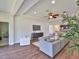 The open living area includes a ceiling fan, modern decor, and seamless access to the kitchen and dining spaces at 13908 Artesa Bell Dr, Riverview, FL 33579