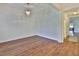Spacious living room with hardwood floors and an elegant chandelier at 13908 Artesa Bell Dr, Riverview, FL 33579