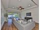 Comfortable living room features modern decor, open layout, and sliding doors to the outdoor area at 13908 Artesa Bell Dr, Riverview, FL 33579